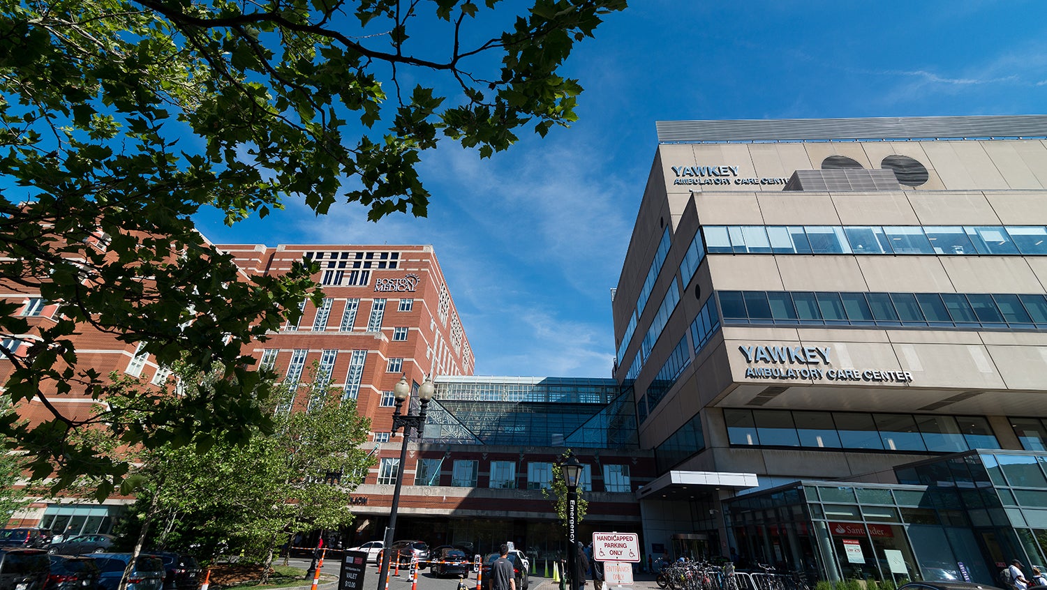 View of the front of the Boston Medical Center Yawkey and Moakley Buildings in front of blue sky