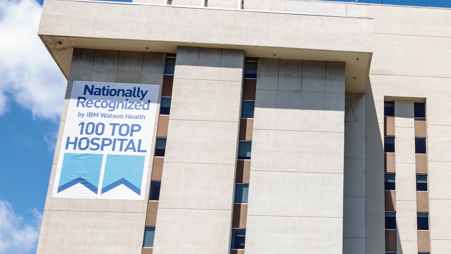 top 100 hospital rankings poster on hospital exterior