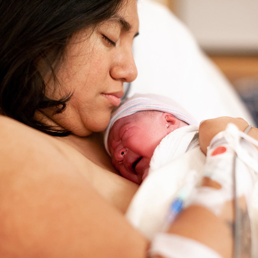 newborn baby skin to skin contact with mother in hospital